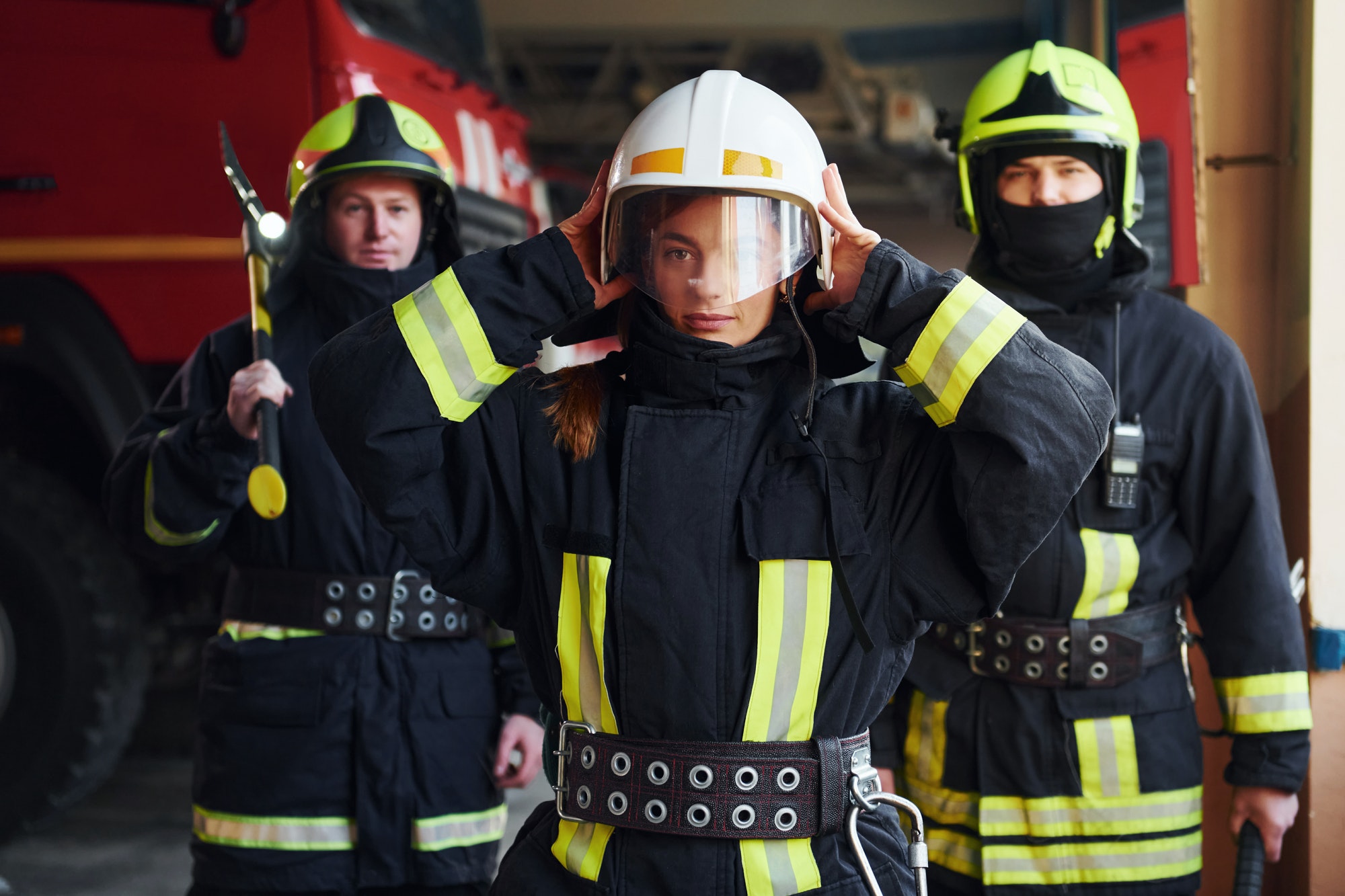 Group of firefighters in protective uniform that is on station
